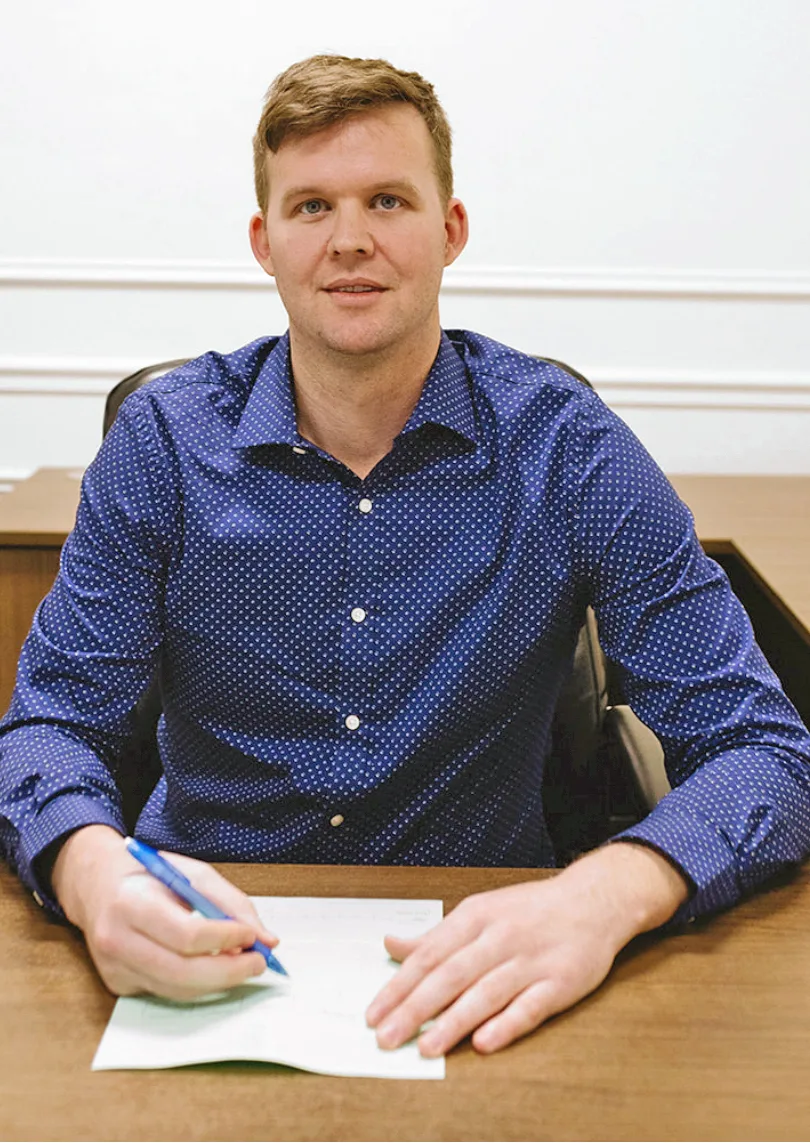 Eric Tollefson, Lawyer at North Star Law, seated at his desk
